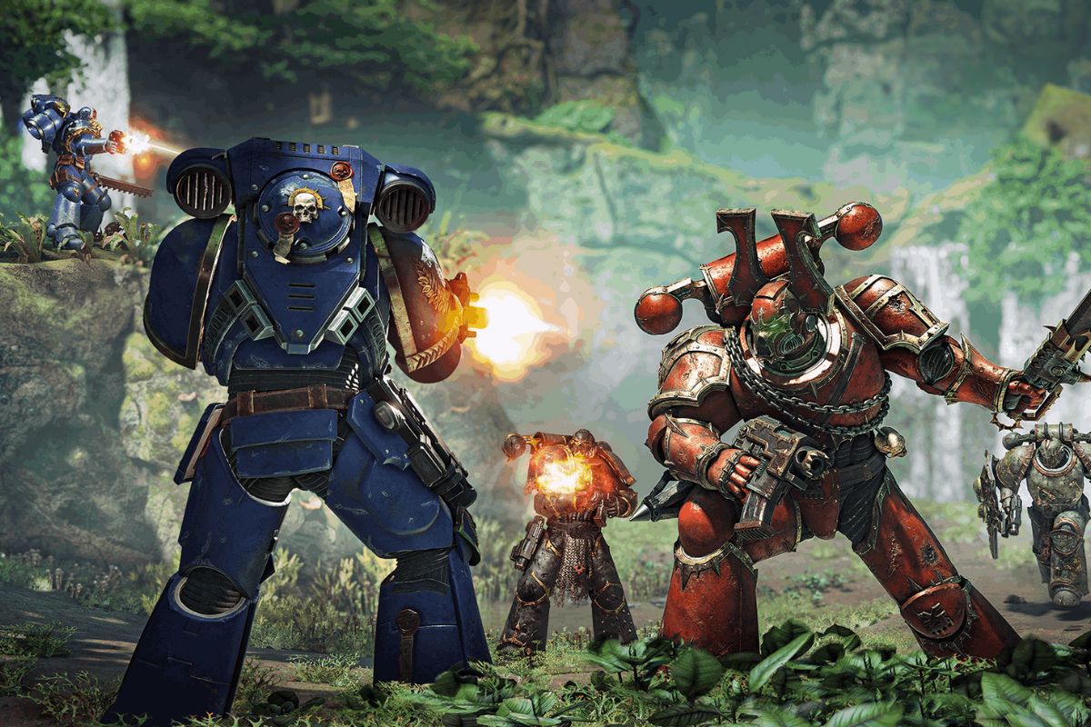 Armored soldiers in blue and red power suits engage in an intense battle in a lush, forested environment.