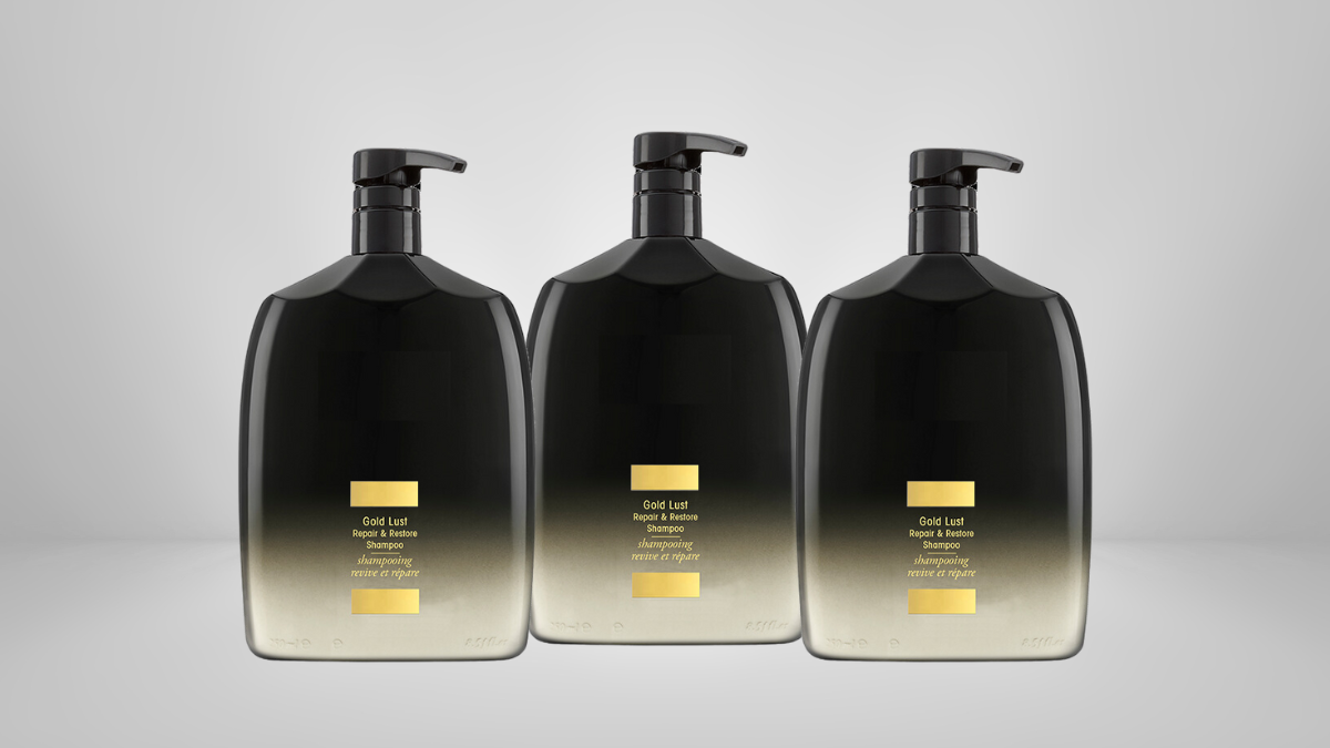 Three sleek black and gold hand soap dispensers with pump tops, elegantly displayed against a neutral background for a clean, modern look.
