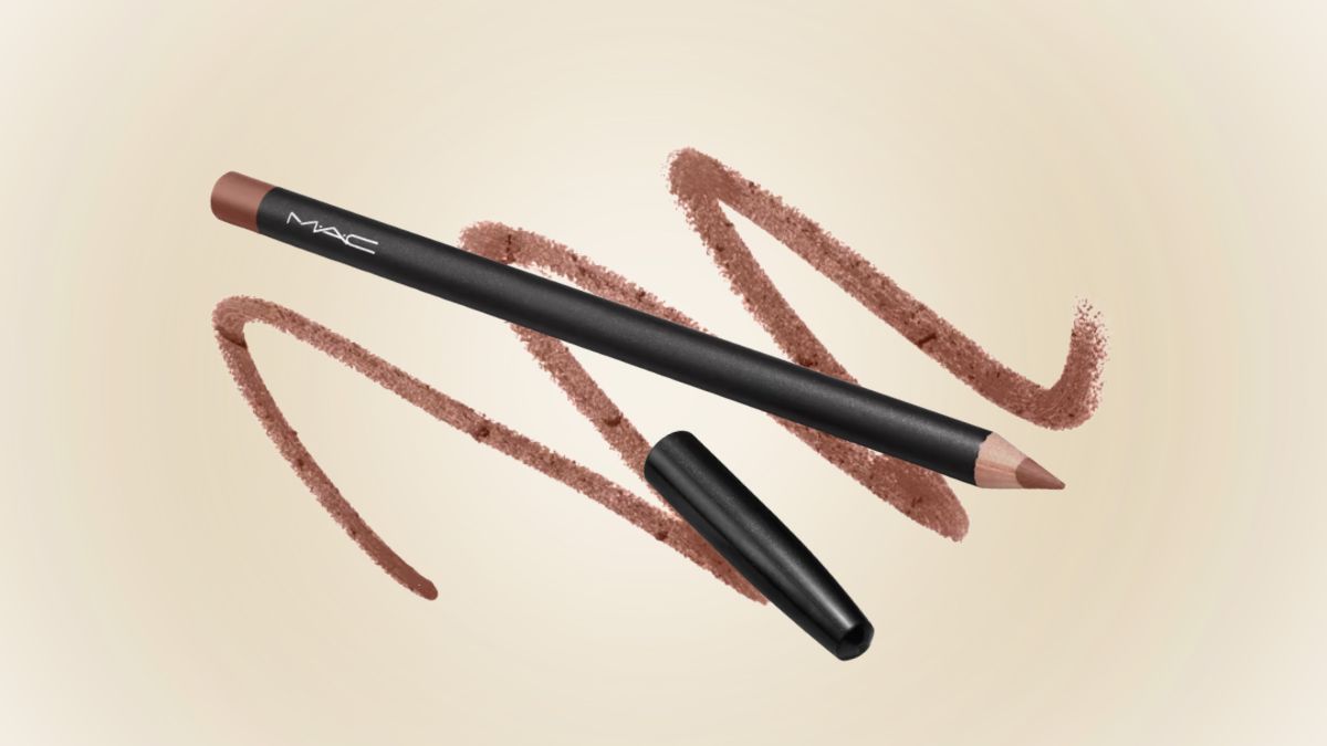 A MAC lip liner pencil with its cap removed is displayed on a soft beige background, with brown-beige swirls showing its creamy texture and shade.
