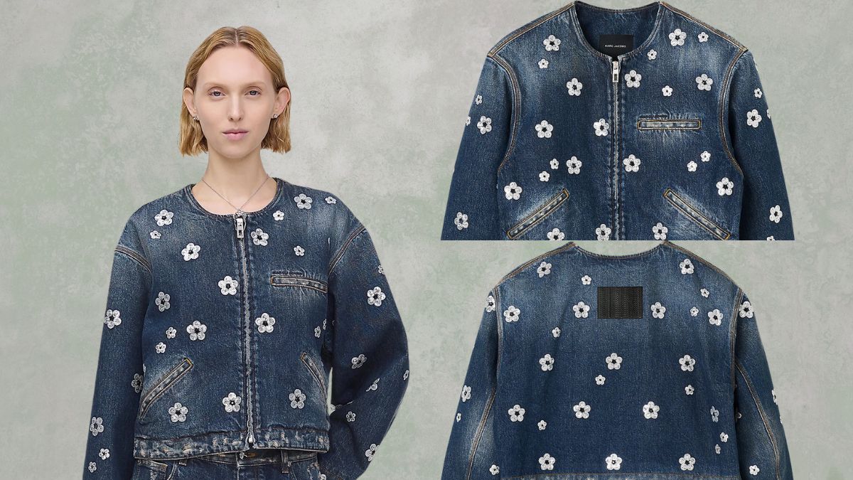 A denim cropped jacket with white sequin daisy flowers, a front zipper, and pockets, shown on a model and in close-up views.