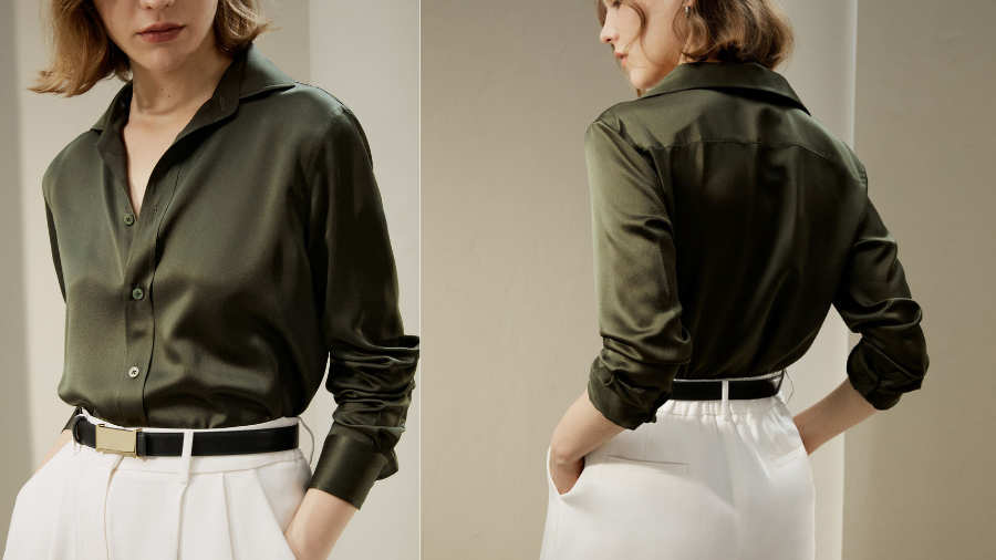 Woman wearing a dark green satin blouse paired with high-waisted white trousers and a black belt, shown from both front and back angles.
