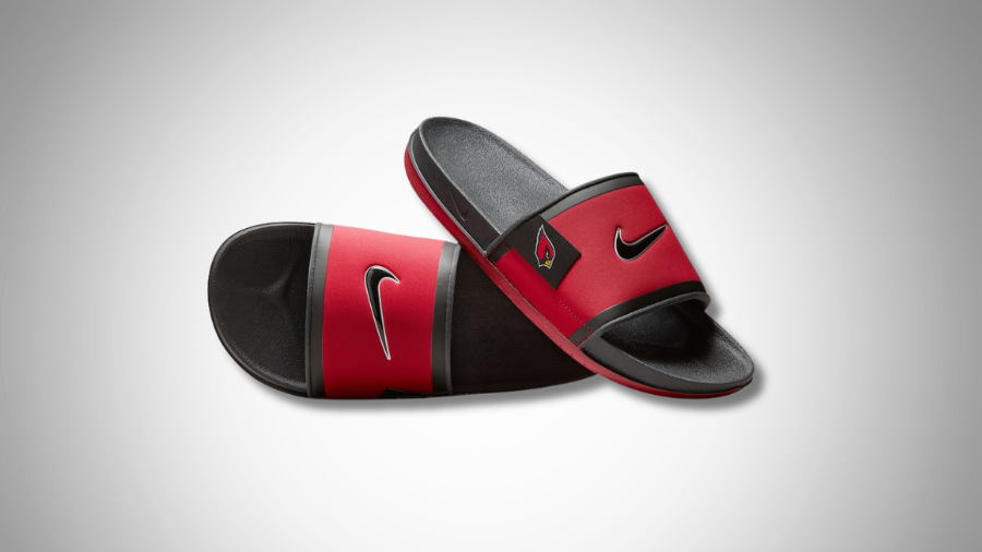 Arizona Cardinals-themed Nike slide sandals in red and black, featuring the team logo and Nike swoosh on the straps.