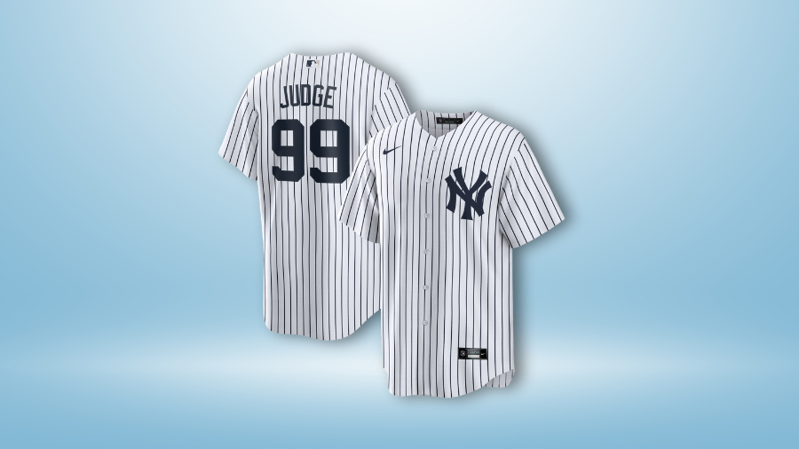 New York Yankees pinstriped jersey featuring "Judge 99" on the back and the Yankees logo on the front, displayed against a light blue background.